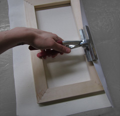 The canvas is stretched around a wooden stretcher bar frame 