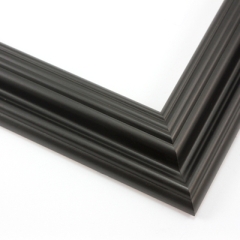 This solid wood, matte black frame features a reverse scoop profile.  The inner lip recedes in a series of curved steps into a steep dip and a raised outer edge. 

1.75 " width: ideal for medium size images.  A wide variety of photographs, paintings and prints will be enhanced within this unique frame.